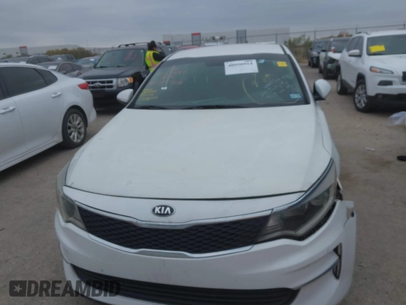 2016 Kia Optima LX with VIN KNAGT4L39G5104726, listed as a IAAI auction lot 40950914 with 128,728 mi miles. Bid and sale history available at carsss.com. Image 12.
