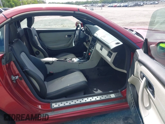2000 Mercedes-Benz SLK 230 Kompressor with VIN WDBKK47F2YF146797, listed as a IAAI auction lot 42823113 with 35,881 mi miles and . Bid and sale history available at DreamBid. Image 5.