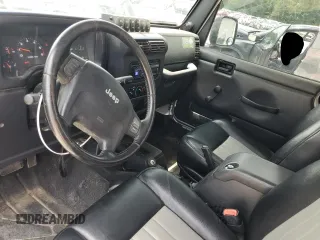 2005 Jeep Wrangler X with VIN 1J4FA39S55P353789, listed as a Copart auction lot 62469015 with 143,817 mi miles and Salvage title. Bid and sale history available at DreamBid. Image 8.