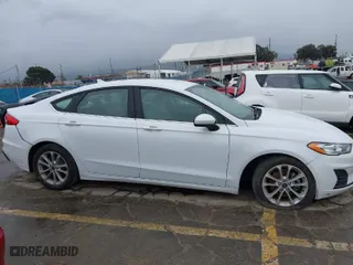 2020 Ford Fusion Hybrid SE with VIN 3FA6P0LU2LR253612, listed as a IAAI auction lot 41798850 with 58,219 mi miles. Bid and sale history available at carsss.com. Image 13.