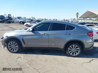 2015 BMW X6 xDrive50i with VIN 5UXKU6C52F0F94060, listed as a IAAI auction lot 41299202 with 67,835 mi miles. Bid and sale history available at carsss.com. Image 14.