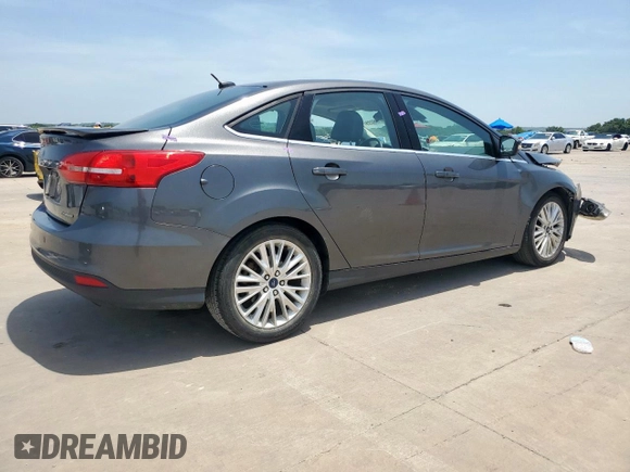 2017 Ford Focus Titanium with VIN 1FADP3J20HL253446, listed as a Copart auction lot 64196895 with 150,633 mi miles and Salvage title. Bid and sale history available at DreamBid. Image 3.