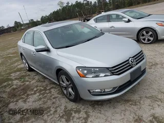 2015 Volkswagen Passat 1.8T SE w/Sunroof & Nav with VIN 1VWBT7A38FC019255, listed as a IAAI auction lot 41872887 with 121,845 mi miles. Bid and sale history available at carsss.com. Image 1.