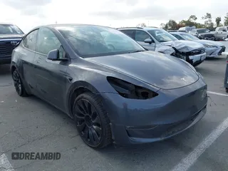 2022 Tesla Model Y Performance with VIN 7SAYGDEF7NF563433, listed as a IAAI auction lot 41713557 with Not Provided miles and . Bid and sale history available at DreamBid. Image 1.