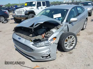 2019 Ford Fusion SE with VIN 3FA6P0LU1KR222141, listed as a IAAI auction lot 42000677 with 122,898 mi miles and . Bid and sale history available at carsss.com. Image 6.