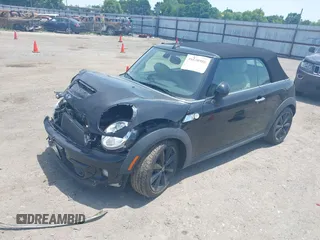 2013 MINI Convertible S with VIN WMWZP3C59DT550746, listed as a IAAI auction lot 39538986 with 59,934 mi miles and . Bid and sale history available at DreamBid. Image 2.