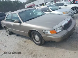 2001 Mercury Grand Marquis LS z VIN 2MEFM75W21X614764, wystawiony jako IAAI lot #41674859 z przebiegiem 242 503 mil mil oraz . Historia ofert i sprzedaży dostępna na DreamBid. Obrazek 1.