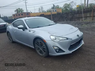 2015 Scion FR-S z VIN JF1ZNAA10F9704134, wystawiony jako IAAI lot #42167308 z przebiegiem 130 242 mil mil oraz . Historia ofert i sprzedaży dostępna na DreamBid. Obrazek 1.