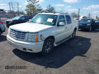 2004 Cadillac Escalade EXT z VIN 3GYEK62N24G294489, wystawiony jako IAAI lot #41887062 z przebiegiem 159 000 mil mil oraz . Historia ofert i sprzedaży dostępna na DreamBid. Obrazek 2.