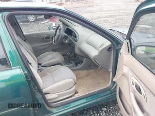 1999 Ford Contour SE Fleet with VIN 1FAFP66L3XK227522, listed as a IAAI auction lot 41702873 with 140,926 mi miles. Bid and sale history available at carsss.com. Image 5.