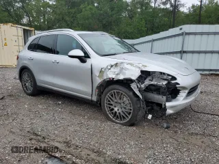 2014 Porsche Cayenne S with VIN WP1AB2A25ELA57213, listed as a Copart auction lot 57843255 with 165,501 mi miles and Salvage title. Bid and sale history available at DreamBid. Image 4.