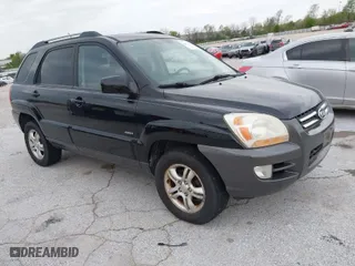 2007 Kia Sportage LX with VIN KNDJE723077397667, listed as a IAAI auction lot 42011122 with 218,744 mi miles. Bid and sale history available at carsss.com. Image 1.