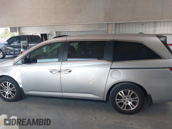 2012 Honda Odyssey EX-L with VIN 5FNRL5H67CB005013, listed as a IAAI auction lot 42295586 with 200,611 mi miles and . Bid and sale history available at DreamBid. Image 14.