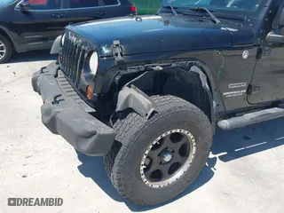 2013 Jeep Wrangler Unlimited Sport with VIN 1C4BJWDG7DL583686, listed as a IAAI auction lot 42037650 with 122,408 mi miles. Bid and sale history available at carsss.com. Image 6.