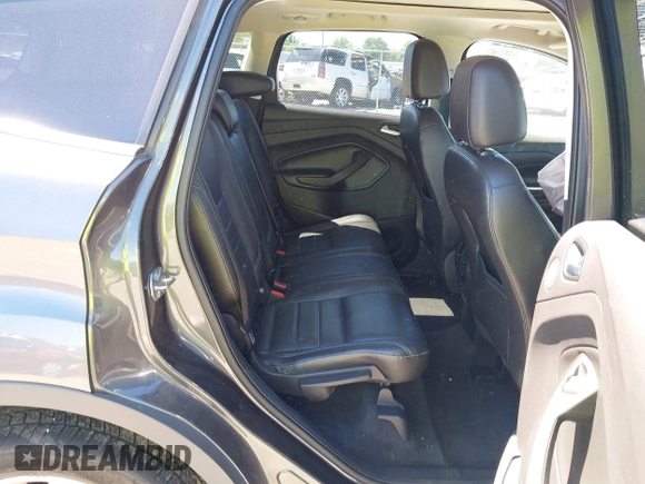 2015 Ford Escape Titanium z VIN 1FMCU9J92FUB01007, wystawiony jako IAAI lot #42319246 z przebiegiem 90 782 mil mil oraz . Historia ofert i sprzedaży dostępna na DreamBid. Obrazek 8.