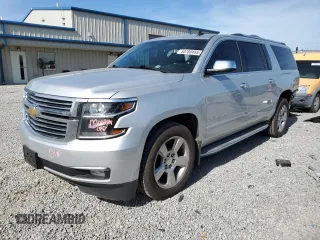 2015 Chevrolet Suburban LTZ with VIN 1GNSKKKC1FR120164, listed as a Copart auction lot 53700455 with 195,815 mi miles and Salvage Title. Bid and sale history available at DreamBid. Image 1.