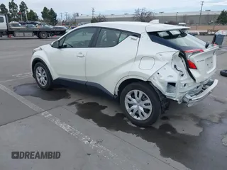 2021 Toyota C-HR LE with VIN JTNKHMBX1M1098521, listed as a IAAI auction lot 41539775 with 14,840 mi miles. Bid and sale history available at carsss.com. Image 3.