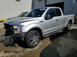 2015 Ford F-150 XL with VIN 1FTEX1C88FFC26544, listed as a Copart auction lot 48242705 with 124,731 mi miles and Salvage Title. Bid and sale history available at carsss.com. Image 1.