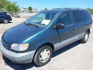 1998 Toyota Sienna LE with VIN 4T3ZF13C0WU038446, listed as a IAAI auction lot 42038331 with 228,832 mi miles. Bid and sale history available at carsss.com. Image 2.