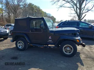 2003 Jeep Wrangler X with VIN 1J4FA39S53P362991, listed as a IAAI auction lot 41607212 with 240,556 mi miles. Bid and sale history available at carsss.com. Image 13.