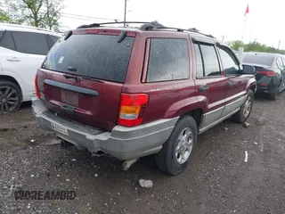 2000 Jeep Grand Cherokee Laredo z VIN 1J4GW48S5YC234942, wystawiony jako IAAI lot #42092378 z przebiegiem 235 168 mil mil oraz . Historia ofert i sprzedaży dostępna na DreamBid. Obrazek 4.