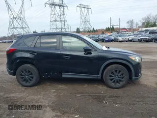 2015 Mazda CX-5 Touring with VIN JM3KE4CY2F0445178, listed as a IAAI auction lot 41828953 with 137,330 mi miles and . Bid and sale history available at DreamBid. Image 14.