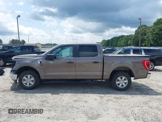 2022 Ford F-150 XL z VIN 1FTEW1EB9NFB50424, wystawiony jako IAAI lot #42553241 z przebiegiem 32 982 mil mil oraz . Historia ofert i sprzedaży dostępna na DreamBid. Obrazek 14.