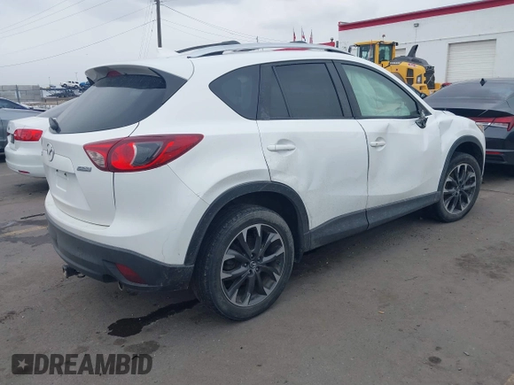 2016 Mazda CX-5 Grand Touring z VIN JM3KE2DY8G0885006, wystawiony jako IAAI lot #41615873 z przebiegiem 118 890 mil mil oraz . Historia ofert i sprzedaży dostępna na DreamBid. Obrazek 4.