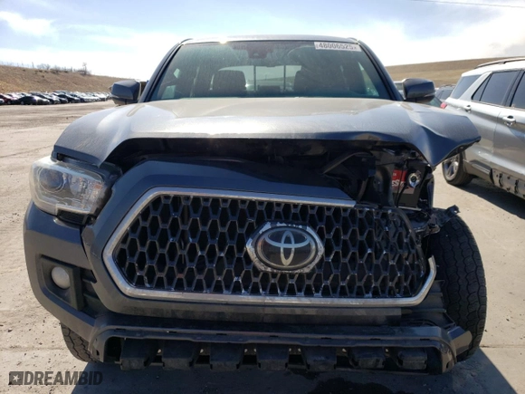 2018 Toyota Tacoma SR with VIN 3TMCZ5AN0JM139859, listed as a Copart auction lot 48006525 with 104,920 mi miles and Salvage Title. Bid and sale history available at carsss.com. Image 5.