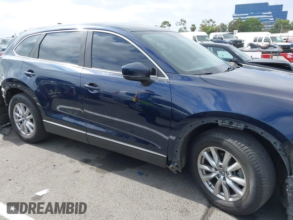 2016 Mazda CX-9 Sport with VIN JM3TCABY3G0123239, listed as a IAAI auction lot 42570700 with 119,414 mi miles and . Bid and sale history available at DreamBid. Image 14.