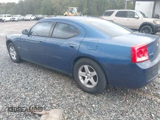 2009 Dodge Charger SXT with VIN 2B3KA33V39H585083, listed as a IAAI auction lot 41911176 with 134,600 mi miles and . Bid and sale history available at carsss.com. Image 3.