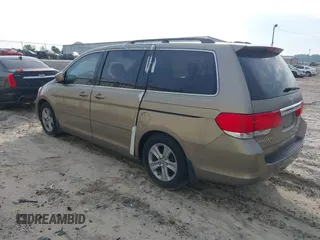 2010 Honda Odyssey Touring with VIN 5FNRL3H9XAB094779, listed as a IAAI auction lot 40412812 with 145,533 mi miles. Bid and sale history available at carsss.com. Image 3.