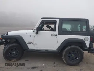 2013 Jeep Wrangler Sport z VIN 1C4AJWAG9DL653348, wystawiony jako IAAI lot #42096860 z przebiegiem 55 575 mil mil oraz . Historia ofert i sprzedaży dostępna na DreamBid. Obrazek 14.
