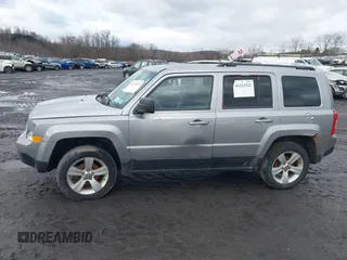 2014 Jeep Patriot Latitude with VIN 1C4NJRFB6ED778433, listed as a IAAI auction lot 41211522 with 127,506 mi miles. Bid and sale history available at carsss.com. Image 14.