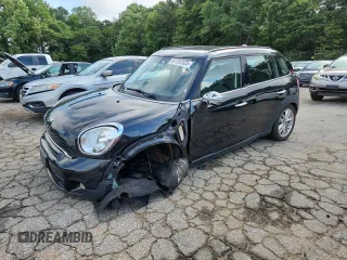 2014 MINI Countryman S with VIN WMWZC3C56EWP25479, listed as a Copart auction lot 61197525 with 101,146 mi miles and Salvage title. Bid and sale history available at DreamBid. Image 1.
