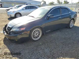 2004 Acura TSX w/Navigation with VIN JH4CL96994C005103, listed as a Copart auction lot 57911445 with 273,458 mi miles and Salvage title. Bid and sale history available at DreamBid. Image 1.