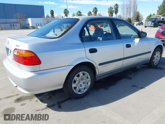1999 Honda Civic LX with VIN JHMEJ6670XS000958, listed as a IAAI auction lot 41620949 with 93,698 mi miles and . Bid and sale history available at DreamBid. Image 4.