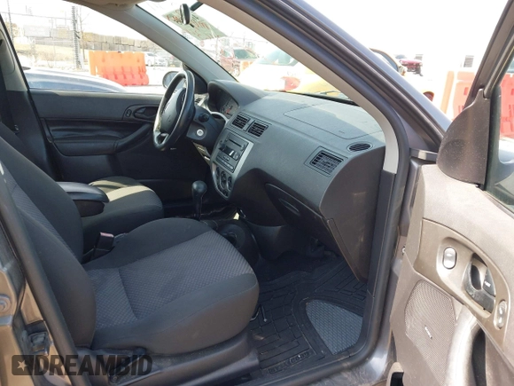 2007 Ford Focus S z VIN 1FAHP37N17W316344, wystawiony jako IAAI lot #41882805 z przebiegiem 262 422 mil mil oraz . Historia ofert i sprzedaży dostępna na DreamBid. Obrazek 5.