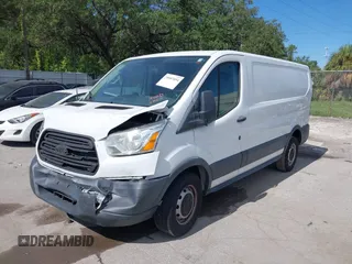 2015 Ford Transit Cargo with VIN 1FTNE1ZM2FKA78621, listed as a IAAI auction lot 41654632 with 234,709 mi miles and . Bid and sale history available at carsss.com. Image 2.