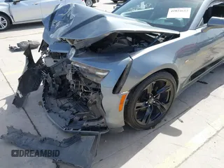 2021 Chevrolet Camaro 1LT z VIN 1G1FB1RX9M0125698, wystawiony jako IAAI lot #41824653 z przebiegiem 69 365 mil mil oraz . Historia ofert i sprzedaży dostępna na DreamBid. Obrazek 6.