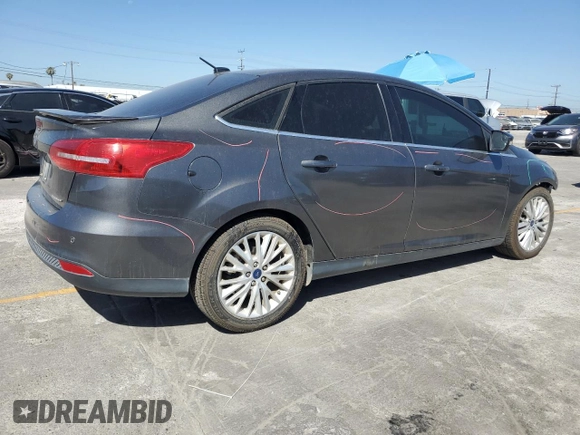 2017 Ford Focus Titanium with VIN 1FADP3J22HL279854, listed as a Copart auction lot 61209135 with 106,323 mi miles and Salvage title. Bid and sale history available at DreamBid. Image 3.