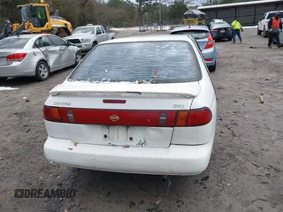 1996 Nissan Sentra XE z VIN 1N4AB41D0TC763104, wystawiony jako IAAI lot #41303640 z przebiegiem 307 682 mil mil oraz . Historia ofert i sprzedaży dostępna na DreamBid. Obrazek 16.