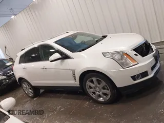 2012 Cadillac SRX Premium Collection z VIN 3GYFNFE38CS591123, wystawiony jako IAAI lot #41827636 z przebiegiem 143 867 mil mil oraz . Historia ofert i sprzedaży dostępna na DreamBid. Obrazek 14.