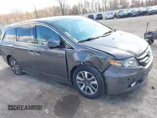 2016 Honda Odyssey Touring Elite with VIN 5FNRL5H90GB128006, listed as a IAAI auction lot 41695438 with 133,337 mi miles. Bid and sale history available at carsss.com. Image 1.