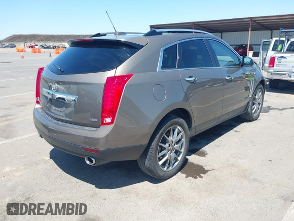 2015 Cadillac SRX Performance Collection with VIN 3GYFNFE35FS569682, listed as a IAAI auction lot 42322229 with 124,365 mi miles and . Bid and sale history available at DreamBid. Image 4.