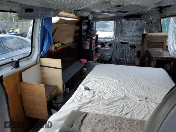 1999 Ford Econoline Passenger XL with VIN 1FBSS31L2XHA95612, listed as a Copart auction lot 72615104 with 211,283 mi miles and Salvage Title. Bid and sale history available at DreamBid. Image 10.