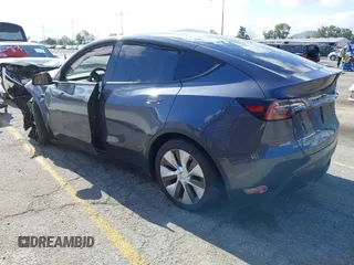 2023 Tesla Model Y Long Range with VIN 7SAYGDEE7PA192488, listed as a IAAI auction lot 42233466 with Not provided miles and . Bid and sale history available at DreamBid. Image 3.