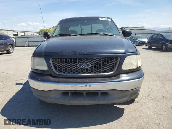 2000 Ford F-150 XL with VIN 1FTRX17L0YKA29295, listed as a Copart auction lot 50719525 with 0 mi miles and Salvage Title. Bid and sale history available at carsss.com. Image 5.