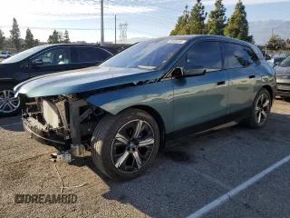 2023 BMW iX xDrive50 with VIN WB523CF03PCM54871, listed as a Copart auction lot 45988445 with 21,056 mi miles and Salvage Title. Bid and sale history available at carsss.com. Image 1.