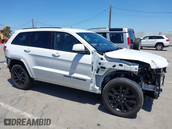 2018 Jeep Grand Cherokee Altitude with VIN 1C4RJEAG2JC404009, listed as a IAAI auction lot 42691304 with 60,948 mi miles and . Bid and sale history available at DreamBid. Image 14.